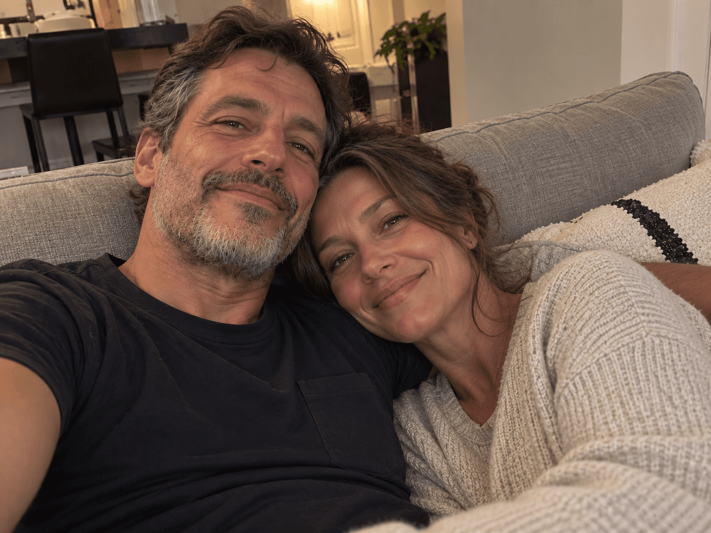 Original photo of a couple relaxing on a sofa